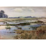 GEORGE EDWARD BUTLER, 1872 - 1936, WATERCOLOUR Landscape, a marshland with a small town on the