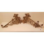 A PAIR OF 19TH CENTURY POLISH BRASS ADJUSTABLE WALL BRACKETS With pierced decoration and hanging