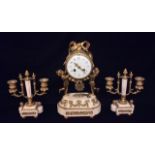 A LATE 19TH CENTURY FRENCH ORMOLU AND WHITE MARBLE FIGURAL CLOCK GARNITURE SET The cylindrical shape