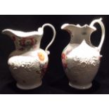 A NEAR PAIR OF VICTORIAN POTTERY WATER JUGS Of classical form, with gadrooned rim and florets,
