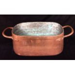 A LARGE VICTORIAN COPPER RECTANGULAR FISH KETTLE With twin handles and covered lid, cascaded brass