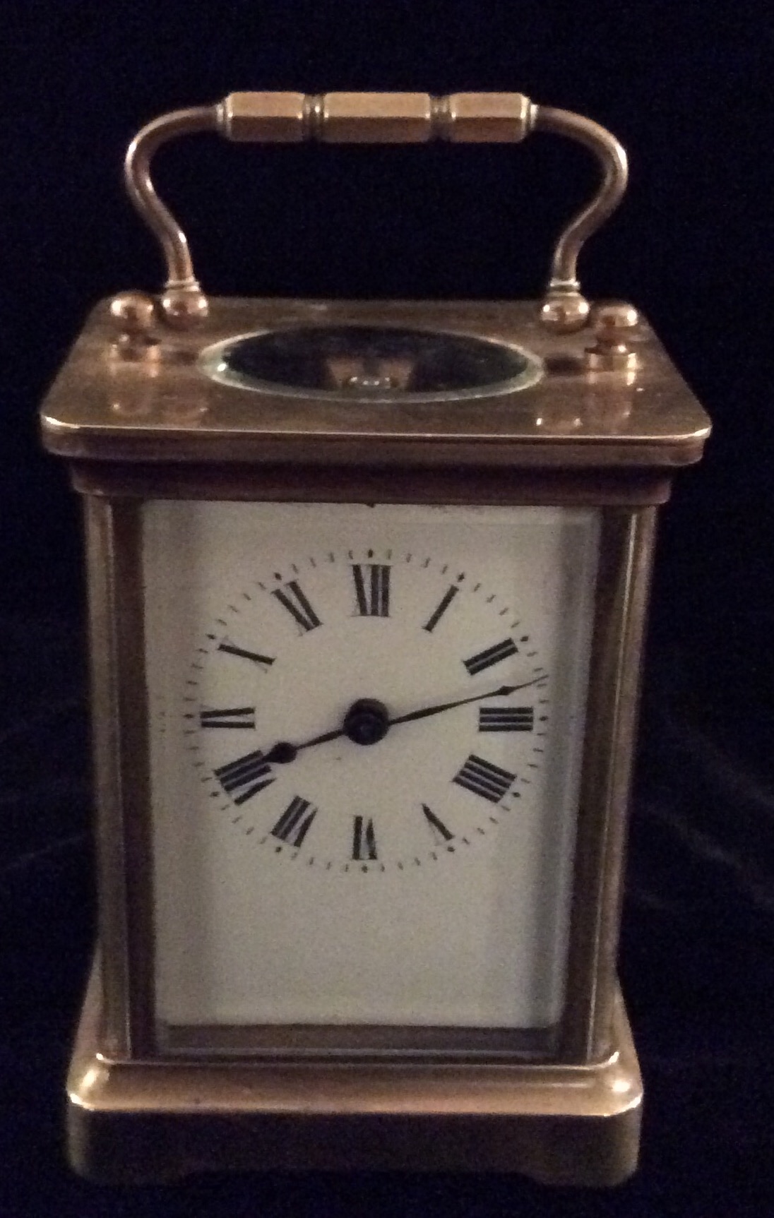 HARRODS LTD LONDON a late 19th century gilt brass carriage clock with swan neck handle, oval