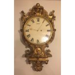 A 19TH CENTURY GILTWOOD CARTEL CLOCK The 10" painted dial with Roman numeral chapter ring and