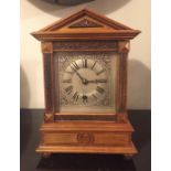 AN EDWARDIAN MAHOGANY MANTLE CLOCK The square silvered dial with Roman numeral chapter ring and