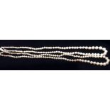 AN EARLY 9CT WHITE GOLD, DIAMOND AND PEARL NECKLACE The single string of graduated pearls leading to