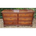 AN 18TH CENTURY OAK AND CROSSBANDED MULE CHEST With a hinged lid over an arrangement of two faux and