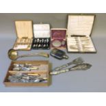 Two sets of silver coffee spoons, and a quantity of silver plated cutlery (part lot behind cabinet)