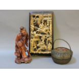 A Chinese wood carving, of a fisherman, a Chinese carved giltwood panel, and a Japanese woven copper