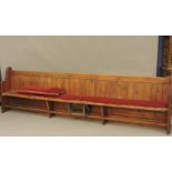 A large Victorian pine pew, 3.3m long