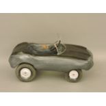 A Triang moulded resin E-Type Jaguar pedal car, with label 'Paris Dakar Triang'