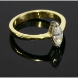 An 18ct gold single stone diamond ring, with a marquise cut diamond estimated as approximately 0.