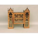 A Victorian mahogany Gothic bookcase top, with opening door to reveal shelving, an apprentice