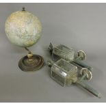 A Phillips 9in terrestrial globe, 37cm high, and a small pair of coaching lamps