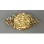 A full sovereign, dated 1909, in a 9ct gold brooch mount