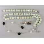 A single row uniform jade bead necklace and matching bracelet suite, an onyx and cultured freshwater