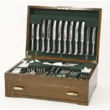 A Garrard canteen of silver plated cutlery, six settings, with pistol grip knives, including carving