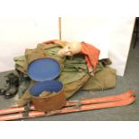 An army battle dress mannequin, wooden skis, smock, army boots, etc