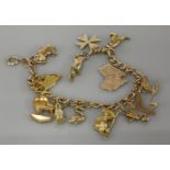 A gold charm bracelet, with assorted 9ct gold charms, 25.06g