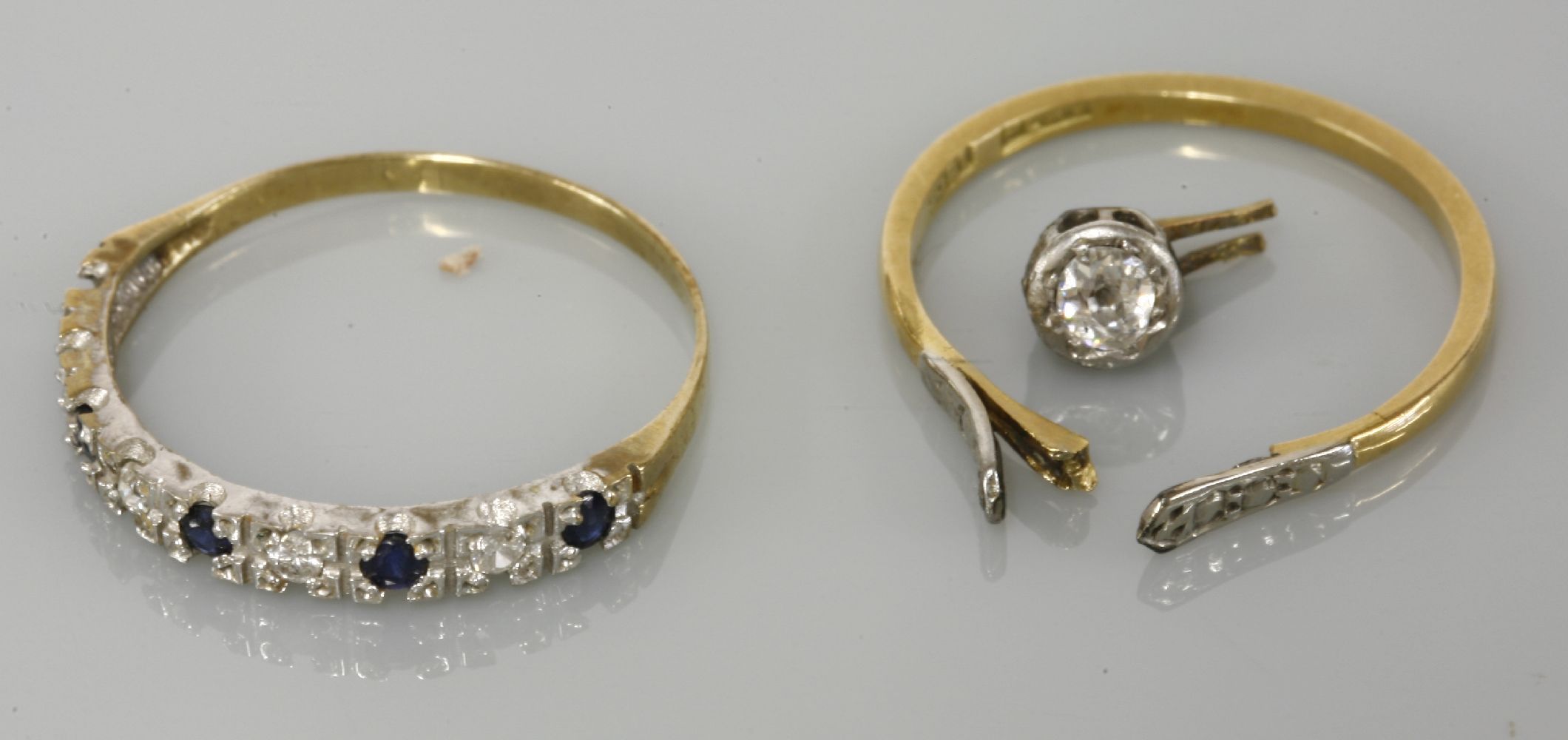 A 9ct gold sapphire and diamond half eternity ring, one diamond deficient, and a single stone