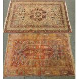 A Kirman rug, with a central medallion on a floral field, 200 x 144cm, and another, 172 x 106cm,