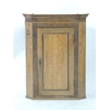 A George III oak corner cupboard, 78cm wide, 100cm high