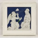 A Cantagalli panel, in the manner of Della Robbia, depicting an angel kneeling before and blessing