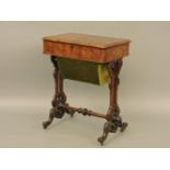 A Victorian burr walnut sewing table, with internal compartments, ornately carved legs, 57cm wide