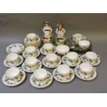 A Royal Worcester Bacchanal part teaset, a pair of figures, and pewter