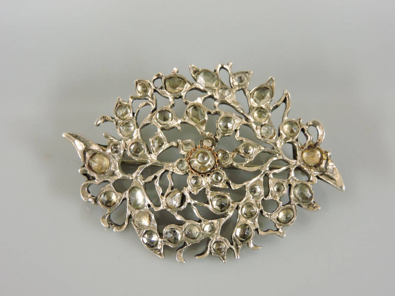 An Indian silver and zircon set brooch, possibly circa 1800, and originally part of a Kondakoora