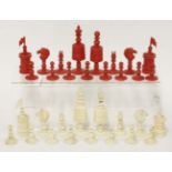 A 19th century bone barleycorn pattern chess set, one side stained red, the other natural, king 10cm