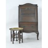 An early 20th century oak drinks cabinet, and a folding Indian table