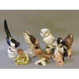 A Beswick Beneagles Whisky Osprey and Buzzard, a Goebel Woodpecker, Royal Doulton Robin and its