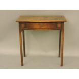 An early 20th century oak writing table, leather inset top over single drawer, 77cm wide