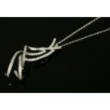 An Italian white gold diamond set pendant, with three curled ribbon strands, claw set with lines