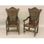 A pair of late 19th/early 20th century carved oak wainscot chairs