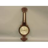 An early 19th century rosewood barometer, with silvered dial