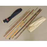 Three fishing rods, including a Persuader by Iron Marks, a fibreglass rod, and another