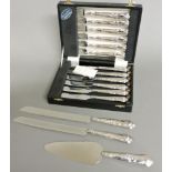 A cased set of six pairs of modern silver steak eaters, a cake slice, and two bread knives, all with