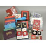 A collection of 20th century proof coin sets, and other coins