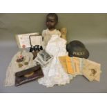 A collection of items, to include a WWII police tin hat, medals, postcards, a soldier's pay book,