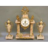 An early 20th century variegated marble gilt metal mounted clock garniture, and a pair of