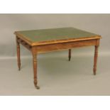 An early 19th century mahogany four drawer writing table, on turned tapering legs