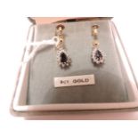 A pair of sapphire and diamond drop earrings, one screw fitting not gold