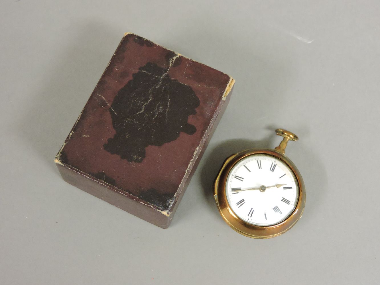 An early to mid 19th century pair cased brass pocket watch, with key wind and fusee movement, signed