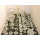 A quantity of Stuart leaf pattern drinking glasses, Webb drinking glasses, a decanter, a cut glass