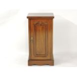 A late Victorian walnut pot cupboard, 40.5cm wide