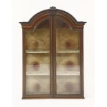 A 19th century inlaid mahogany china display cabinet, with a pair of arched glazed doors, 113cm