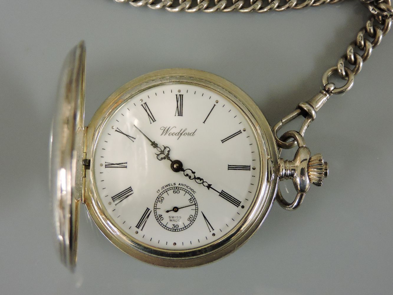 A sterling silver Woodford half hunter pocket watch, with engine turned decoration, suspended on a - Bild 2 aus 2