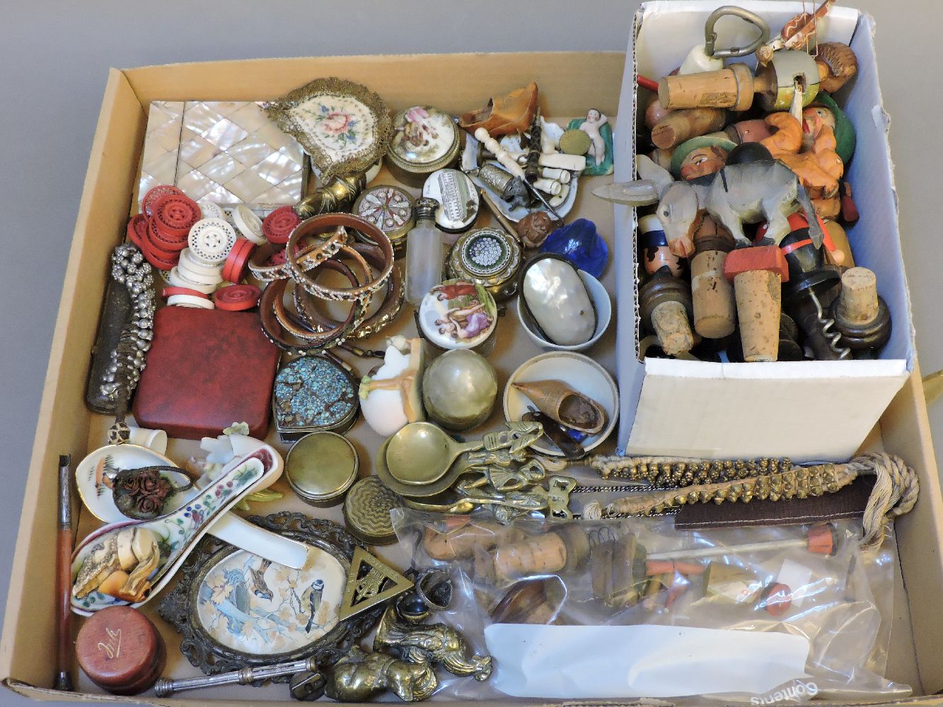 A quantity of early 20th century novelty wine stoppers, cork screws, etc