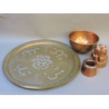 A copper jelly mould, further copper wares, and a large brass charger
